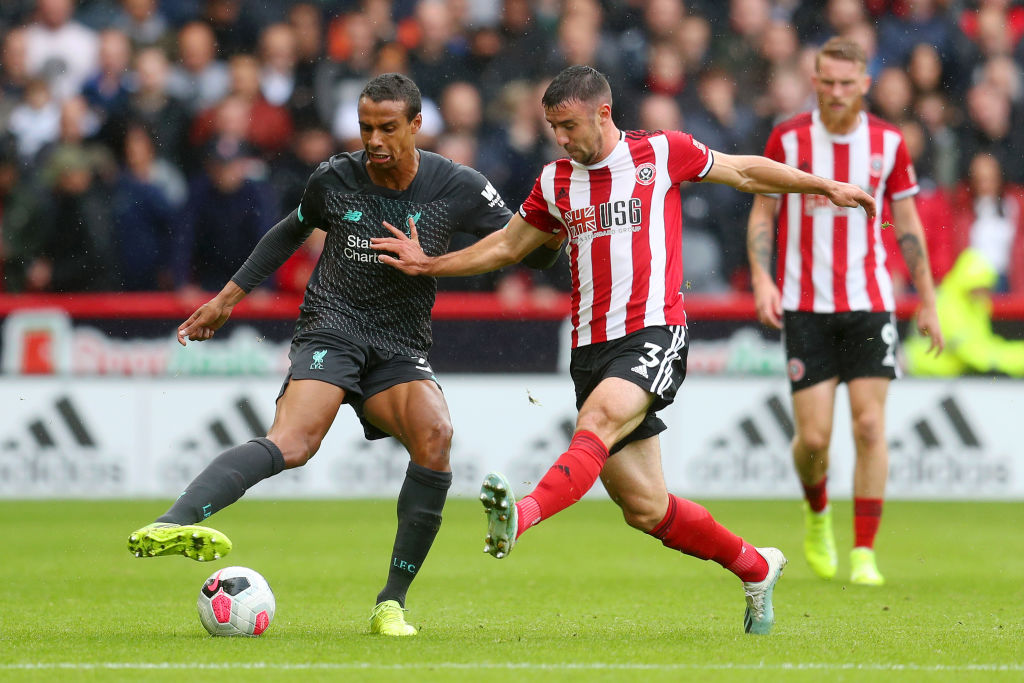 SHEFFIELD, ENGLAND - SEPTEMBER 28: Joel Matip of Liverpool battles for possession with Enda Stevens of Sheffield United during the Premier League match between Sheffield United and Liverpool FC at Bramall Lane on September 28, 2019 in Sheffield, United Kingdom. (Photo by Catherine Ivill/Getty Images)